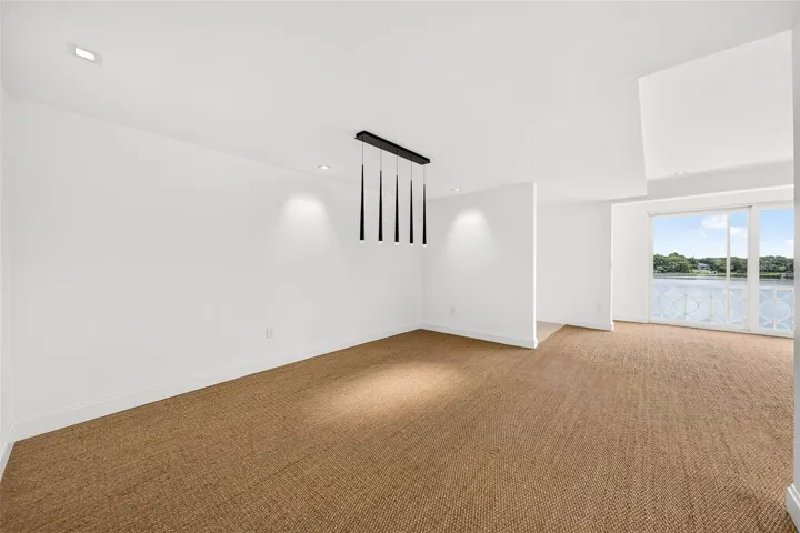 Dining Area Opens to Living Room and Lake View