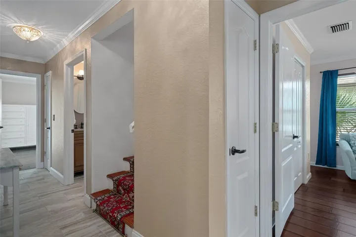 Hall to guest bedrooms and stairs to Primary suite level