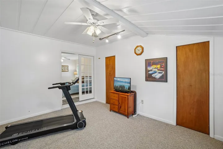 Bonus Room – Located just off the primary bedroom, this flexible bonus room offers carpeting, a ceiling fan, track lighting, and multiple storage closets—well suited for a home office, fitness area, hobby space, or private retreat.