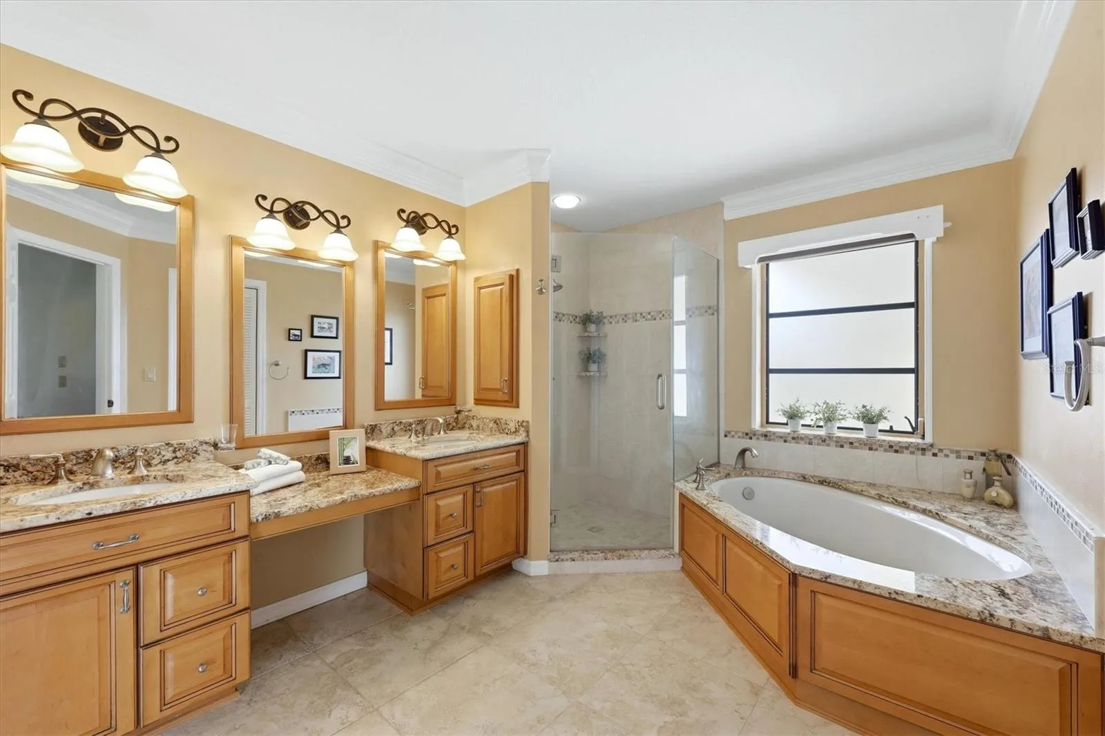 Primary bath with dual vanities, make-up counter, soaking tub, step-in shower - lots of space and updated