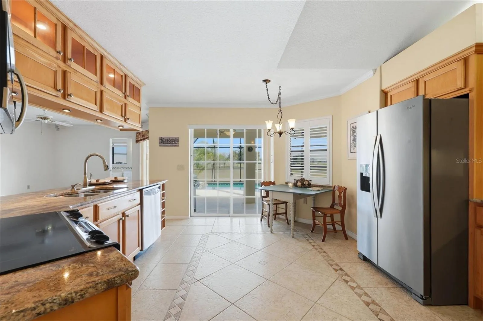 Updated kitchen with dining nook and sliders to the lanai
