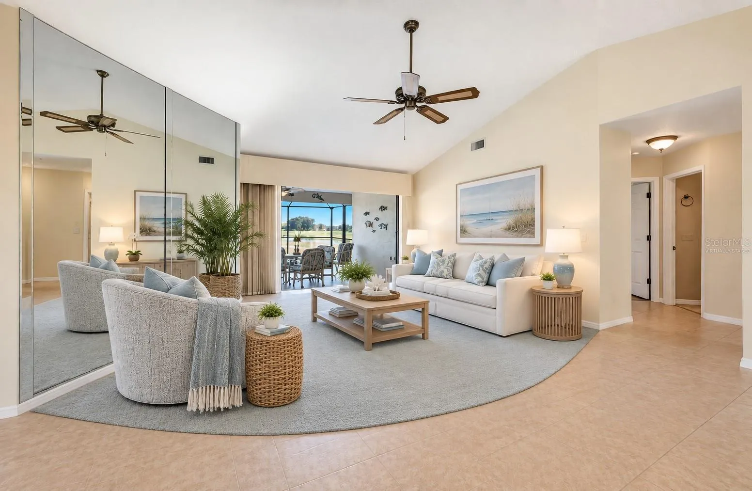Living room virtually staged for your viewing pleasure - sliding glass doors to lanai/pool hide away
