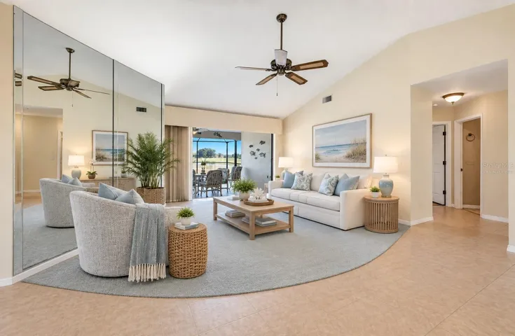 Living room virtually staged for your viewing pleasure - sliding glass doors to lanai/pool hide away