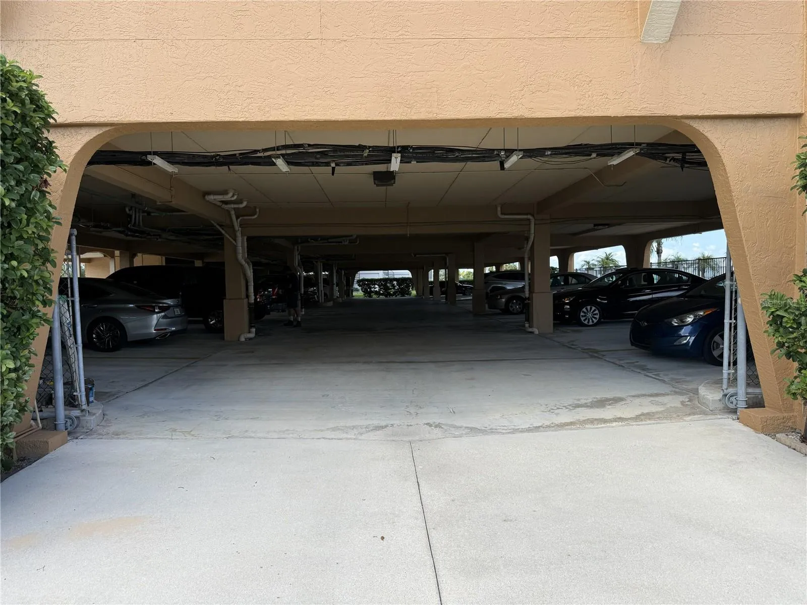 GARAGE ENTRANCE. STORAGE UNIT #18 TO THE IMMEDIATE LEFT. 2 OVERSIZED PARKING SPACES MARKED 18/136 ON THE LEFT SIDE BEFORE THE REMOTE LOBBY DOOR