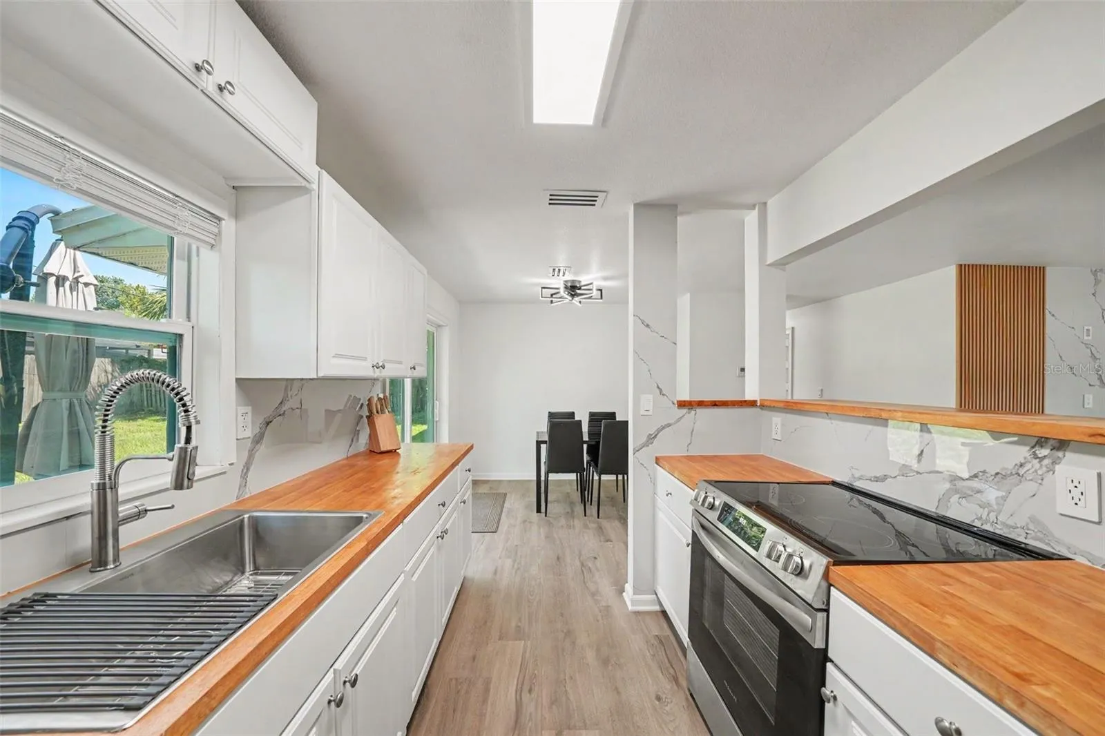 Kitchen has a nice window looking into the backyard. Very airy space.