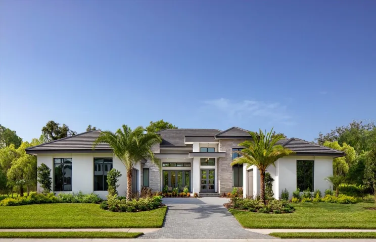 Photo of a previously built Soleil model. This listing has shingle roof, white windows and concrete driveway.