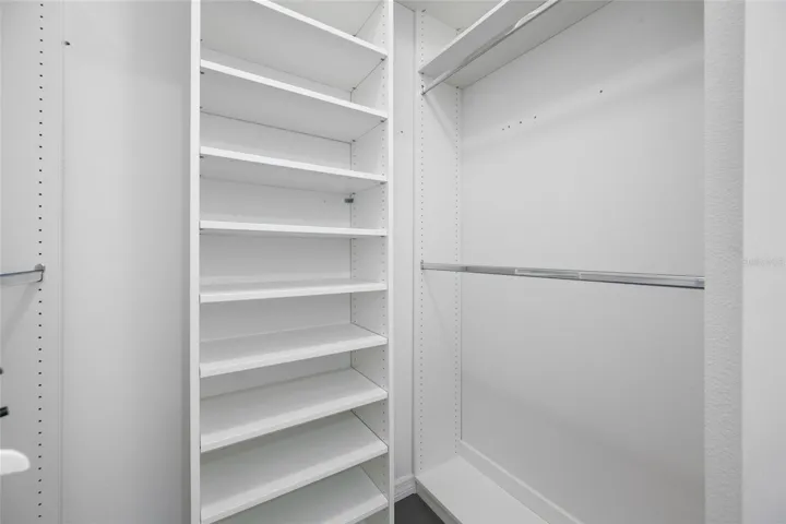 Master closet with custom built-in cabinetry