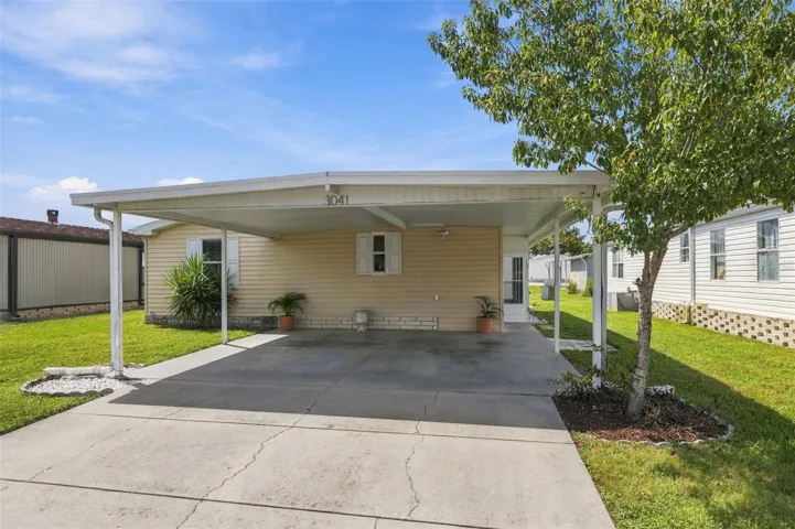 Welcome to 3041 Short Leaf St in Wesley Chapel!  3 bed / 2 bath home with large carport and driveway!