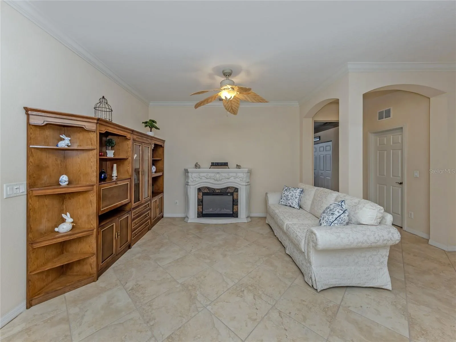 Formal Living Room, with Crown molding leading to Den/4th bedroom