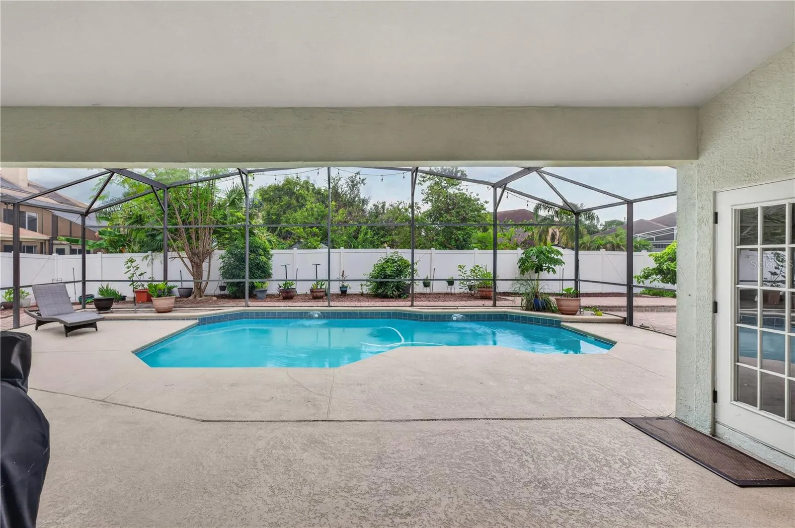 Screened pool area with a spacious deck, offering plenty of room to relax and entertain.