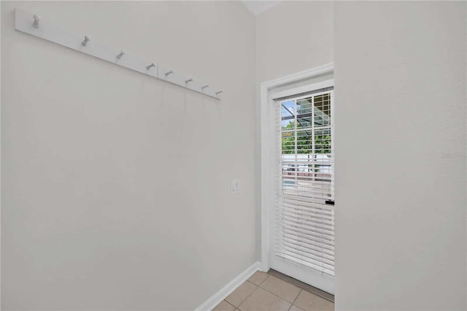 Convenient direct access from the primary bathroom to the screened pool area.