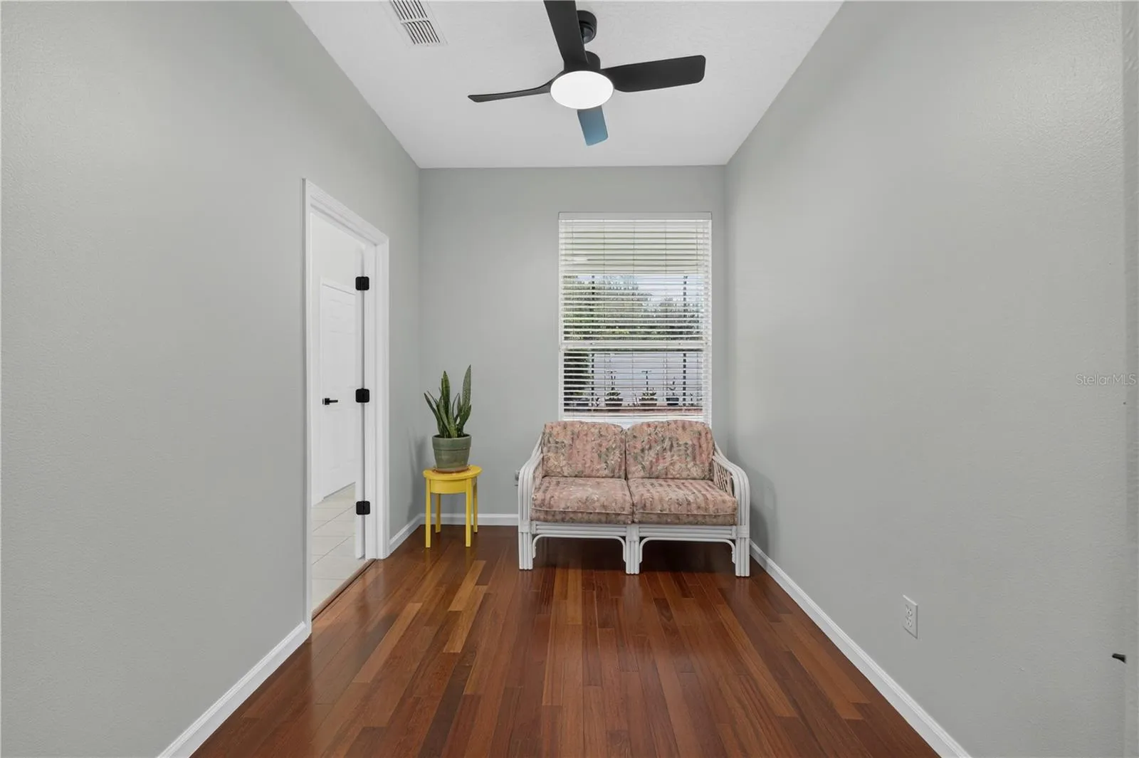 Private sitting area in the primary bedroom, offering a peaceful space to relax or read.