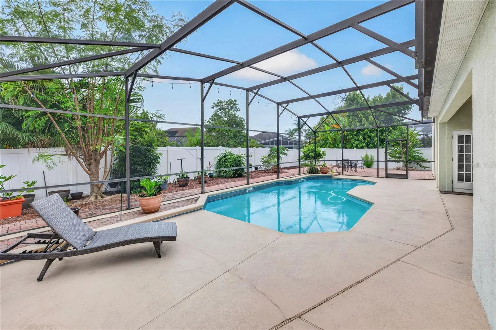 Screened pool area with a spacious deck, offering plenty of room to relax and entertain.
