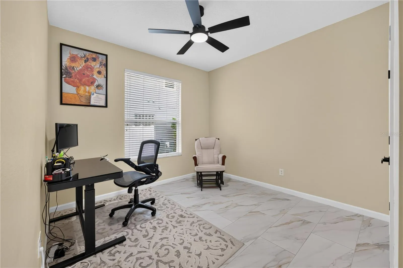Bedroom #4 with high ceilings, a ceiling fan, and flexible use as a home office.