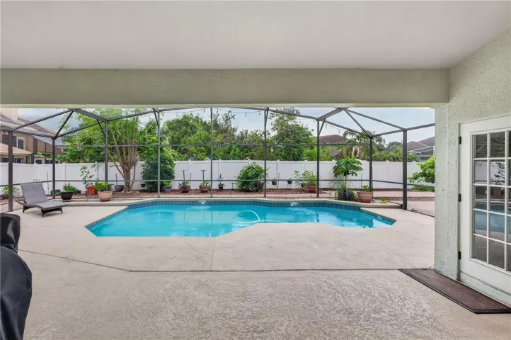 Screened pool area with a spacious deck, offering plenty of room to relax and entertain.