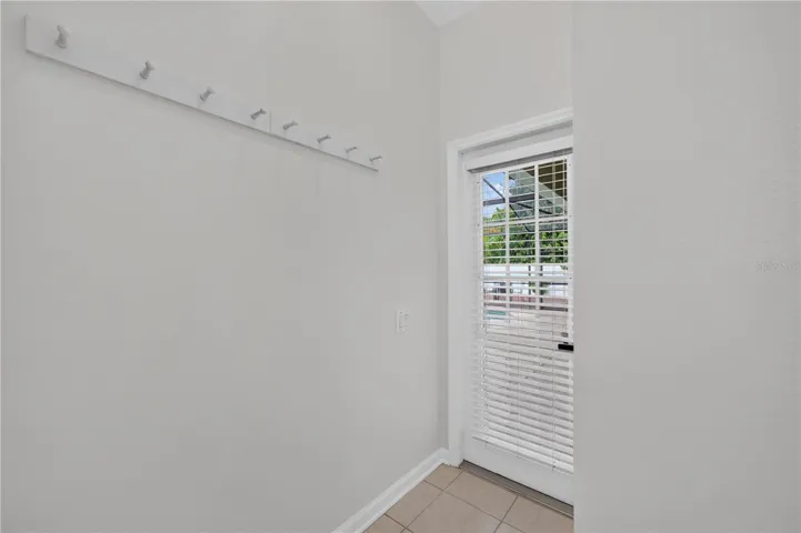 Convenient direct access from the primary bathroom to the screened pool area.