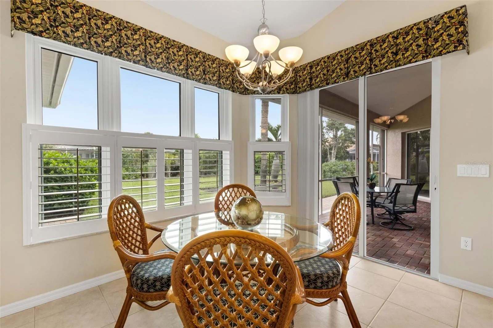 Kitchen nook has sliding doors to the screen lanai