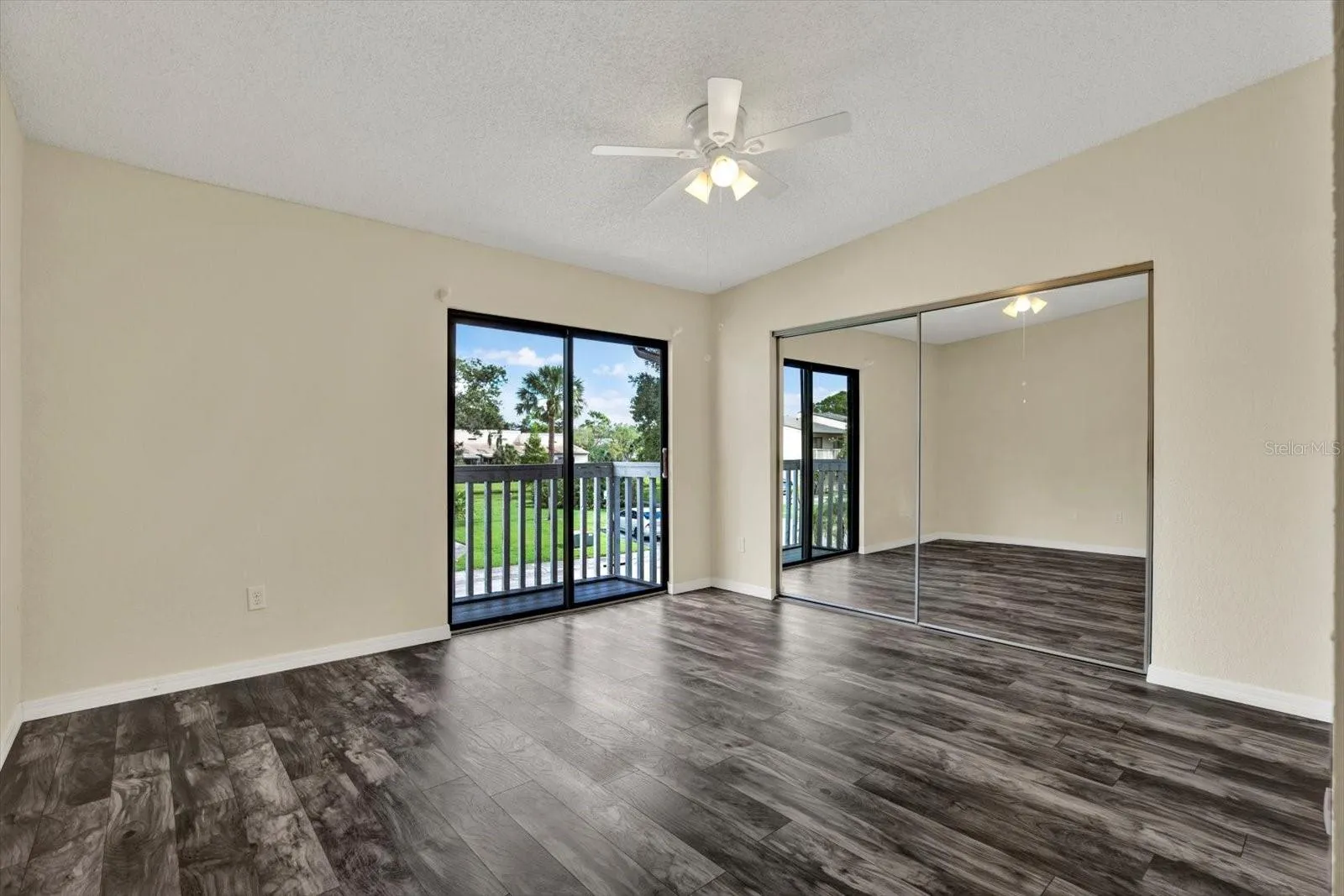 PRIMARY SUITE WITH PRIVATE BALCONY AMPLE CLOSET SPACE AND ENSUITE