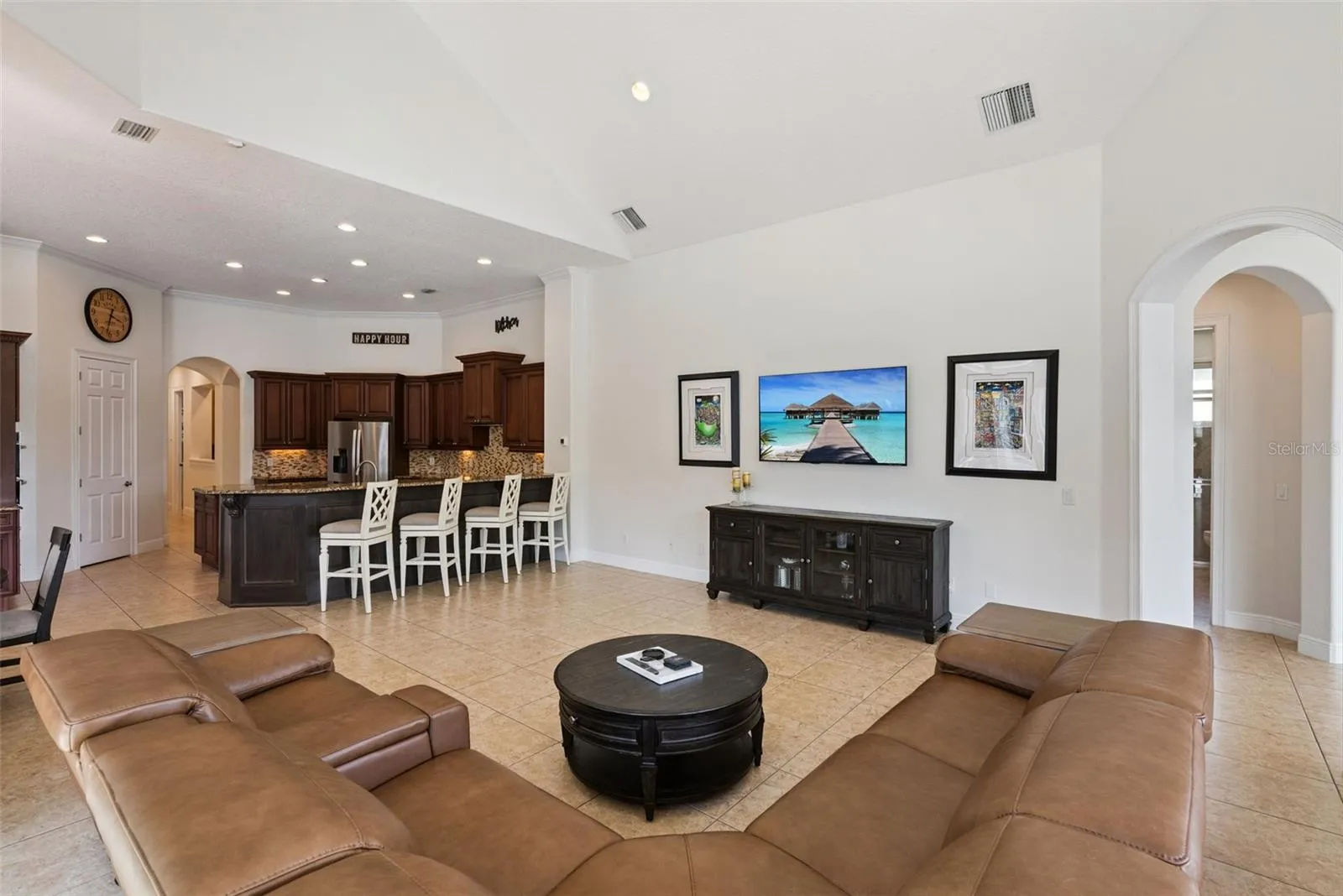 Family RoomThe welcoming family room offers generous gathering space and beautiful views of the pool and backyard.
