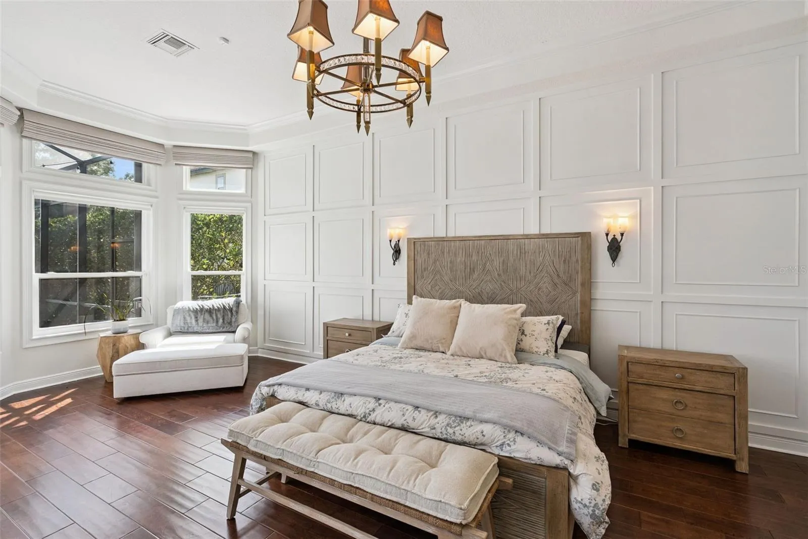 Primary BedroomPrivate primary suite with serene views, custom window treatments and beautifully renovated walk-in closets.Primary ClosetsCustom California Closets built-ins and updated flooring create stylish and organized storage.