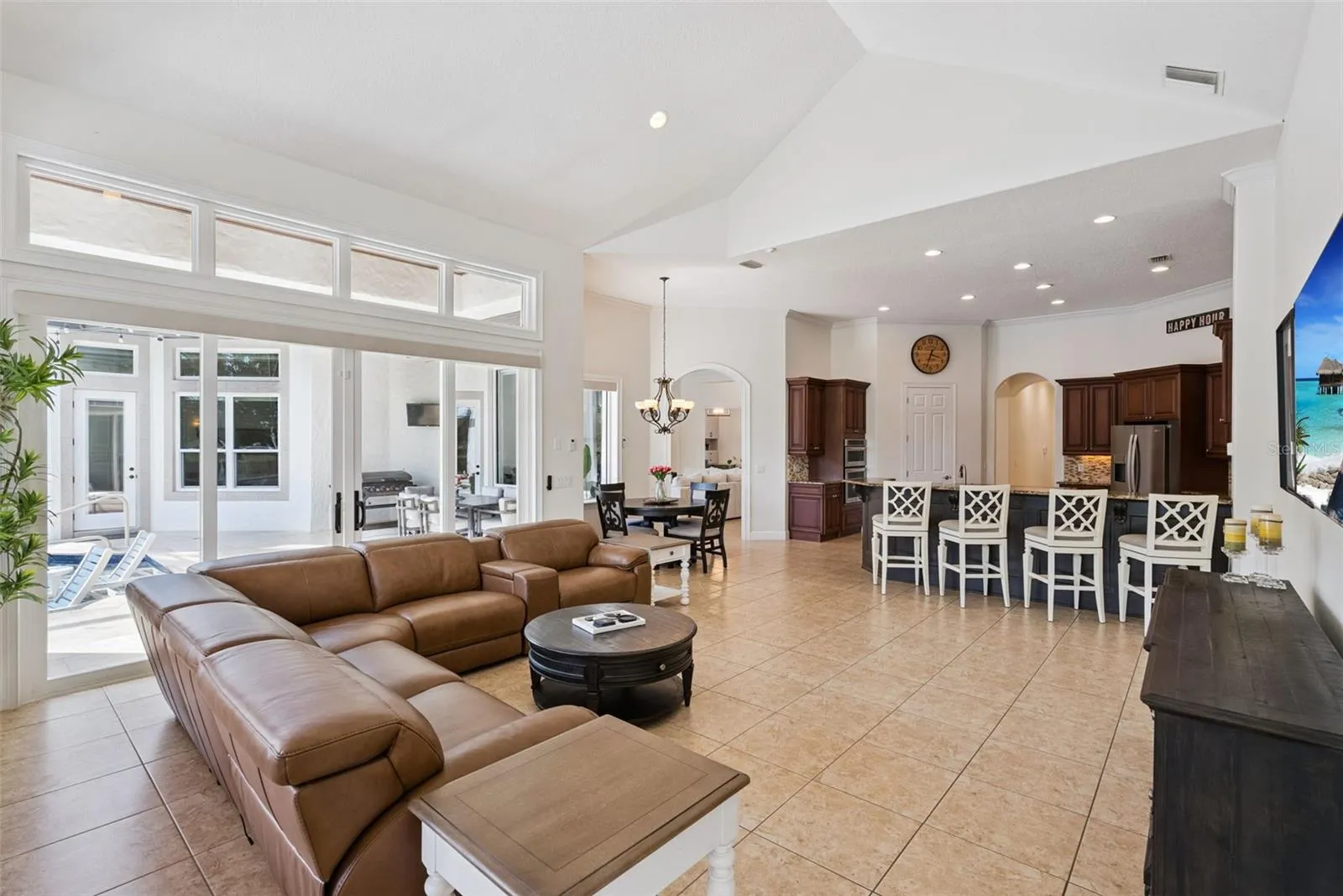 Family RoomThe welcoming family room offers generous gathering space and beautiful views of the pool and backyard.