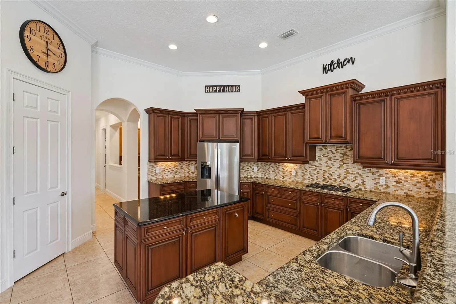 KitchenSpacious kitchen featuring abundant cabinetry, generous counter space and an easy connection to the main living areas.