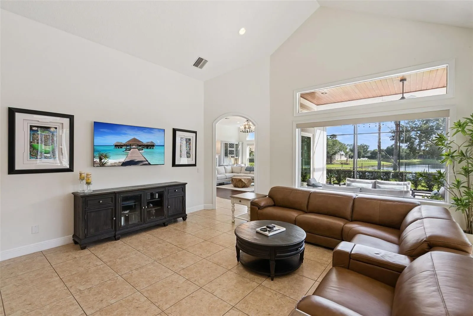 Family RoomThe welcoming family room offers generous gathering space and beautiful views of the pool and backyard.