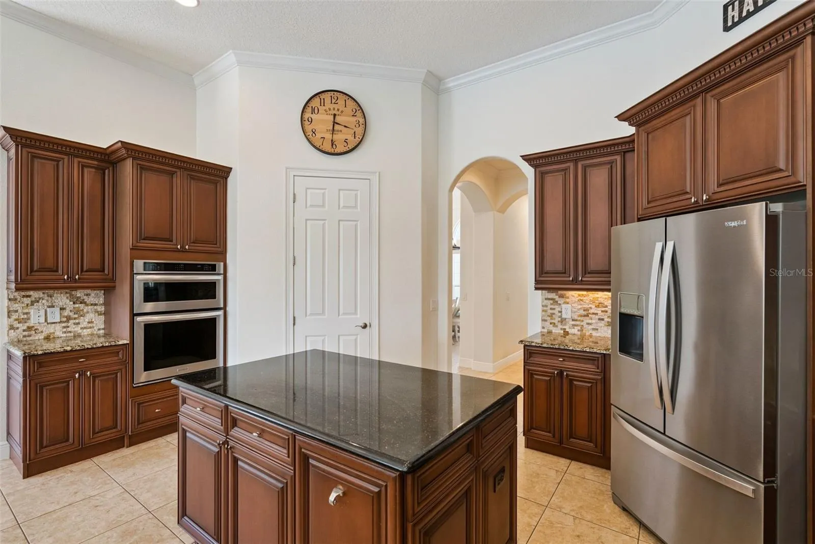 KitchenSpacious kitchen featuring abundant cabinetry, generous counter space and an easy connection to the main living areas.