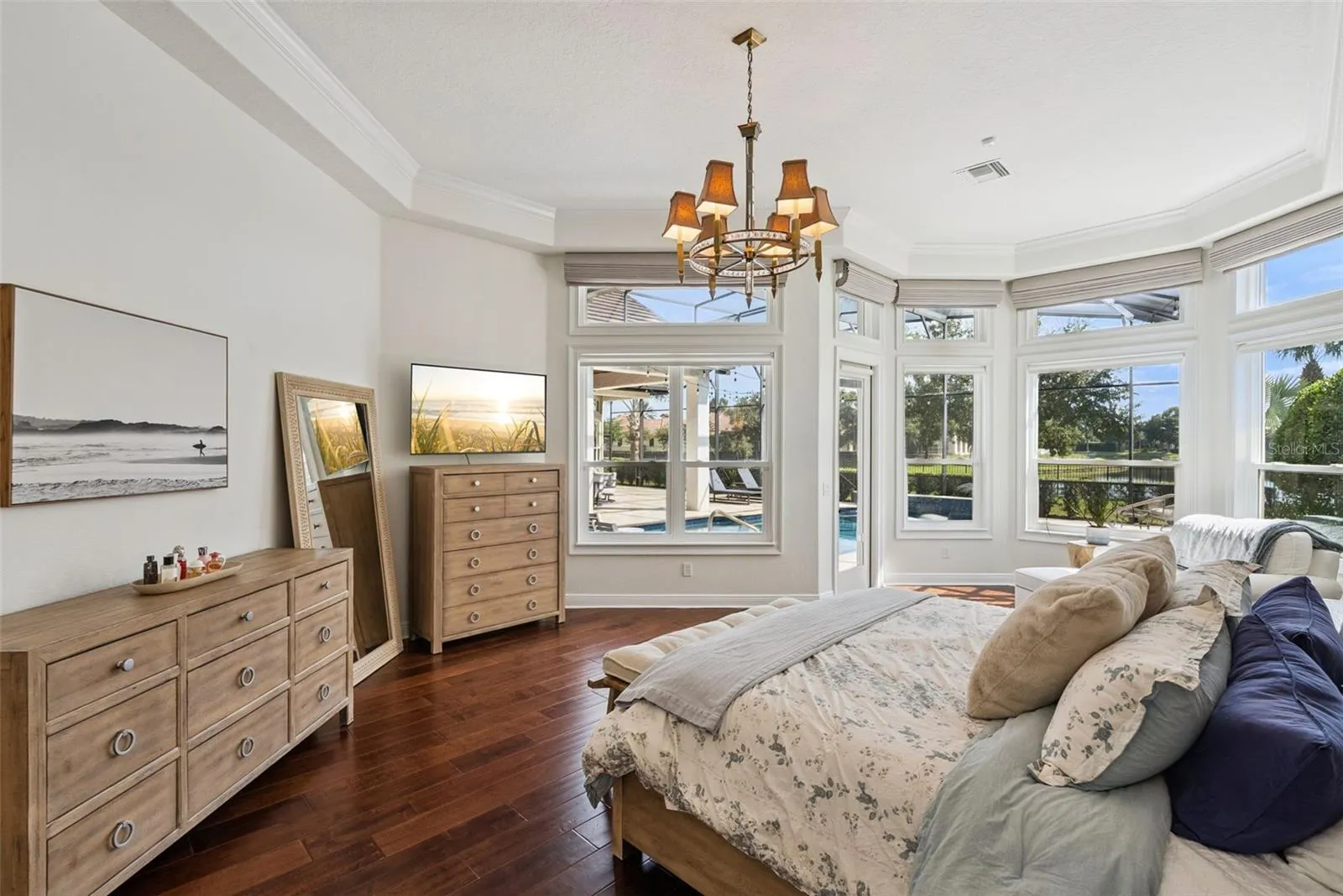 Primary BedroomPrivate primary suite with serene views, custom window treatments and beautifully renovated walk-in closets.Primary ClosetsCustom California Closets built-ins and updated flooring create stylish and organized storage.