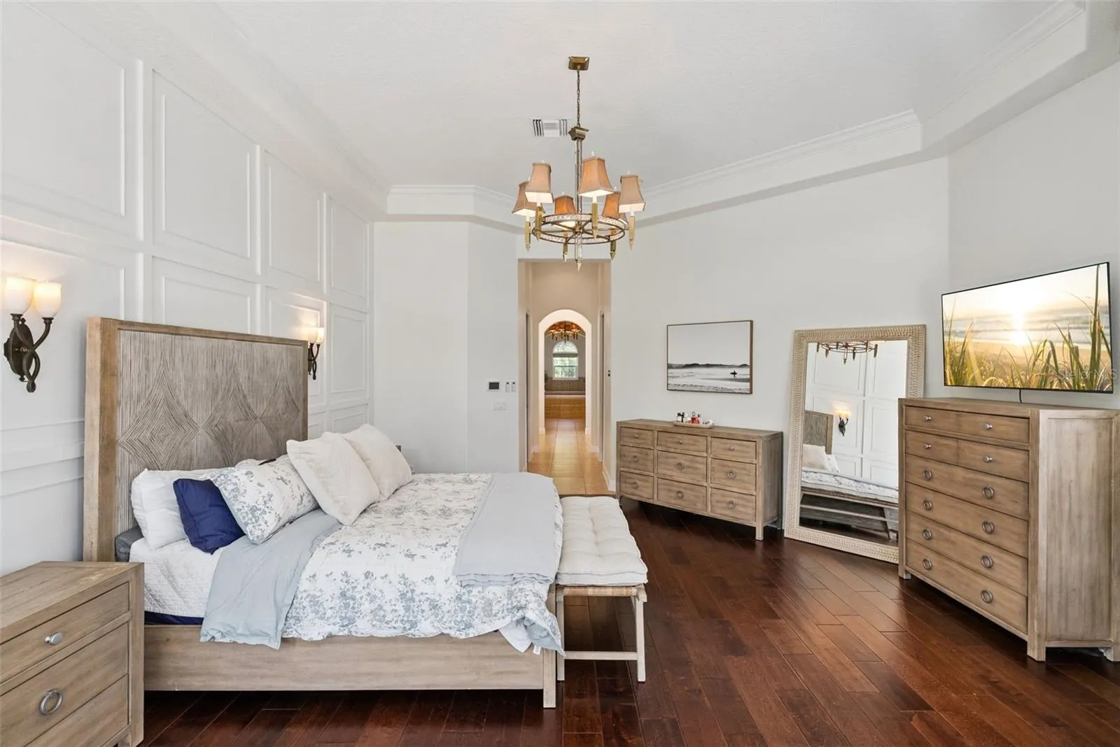 Primary BedroomPrivate primary suite with serene views, custom window treatments and beautifully renovated walk-in closets.Primary ClosetsCustom California Closets built-ins and updated flooring create stylish and organized storage.