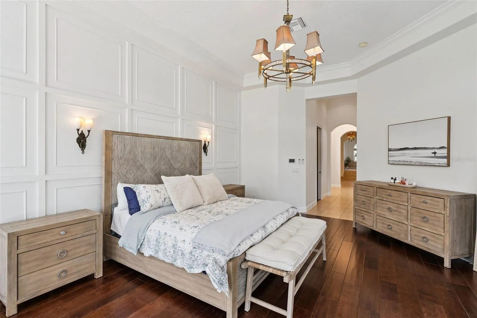 Primary BedroomPrivate primary suite with serene views, custom window treatments and beautifully renovated walk-in closets.Primary ClosetsCustom California Closets built-ins and updated flooring create stylish and organized storage.