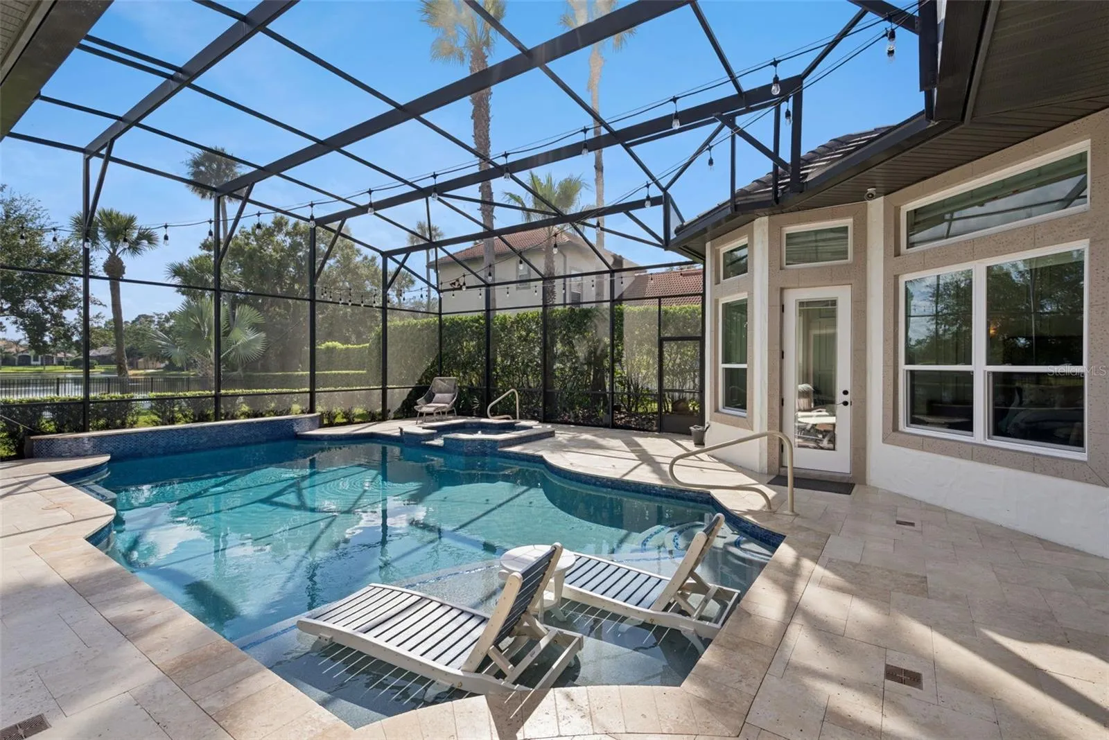 Covered LanaiExpansive covered lanai featuring beautiful tongue-and-groove wood ceilings and plenty of room for outdoor dining and relaxation.Pool AreaUpdated screened pool featuring a pebble-finish interior, sun shelf, glass tile, travertine decking, updated equipment and a pool heater.Backyard and Water ViewsEnjoy tranquil water and conservation views from the private backyard, with the Wekiva Preserve creating a peaceful natural backdrop.Outdoor LivingA beautiful Florida outdoor-living retreat with a spacious covered lanai, updated pool and serene water and conservation views.