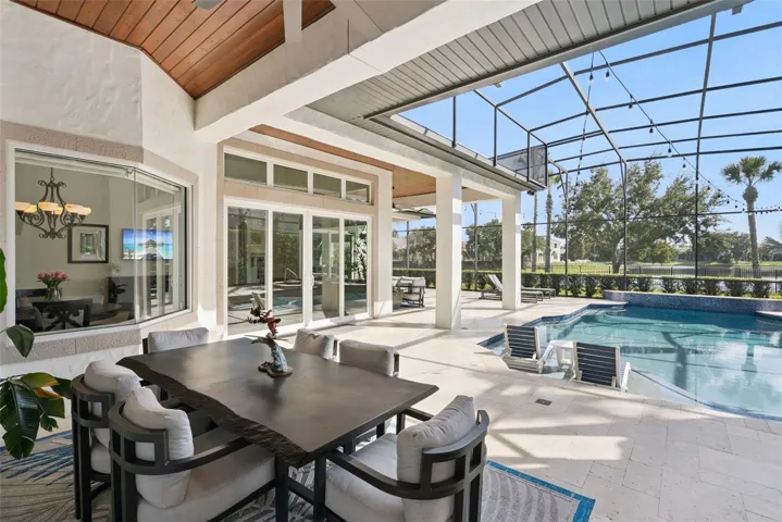 Covered LanaiExpansive covered lanai featuring beautiful tongue-and-groove wood ceilings and plenty of room for outdoor dining and relaxation.Pool AreaUpdated screened pool featuring a pebble-finish interior, sun shelf, glass tile, travertine decking, updated equipment and a pool heater.Backyard and Water ViewsEnjoy tranquil water and conservation views from the private backyard, with the Wekiva Preserve creating a peaceful natural backdrop.Outdoor LivingA beautiful Florida outdoor-living retreat with a spacious covered lanai, updated pool and serene water and conservation views.