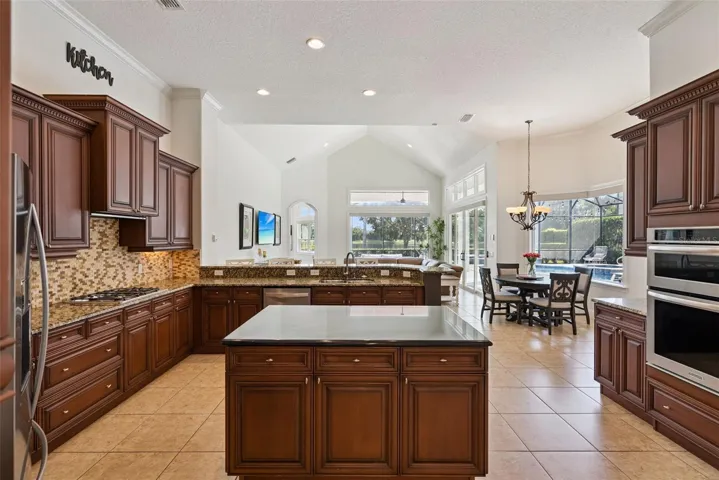 KitchenSpacious kitchen featuring abundant cabinetry, generous counter space and an easy connection to the main living areas.
