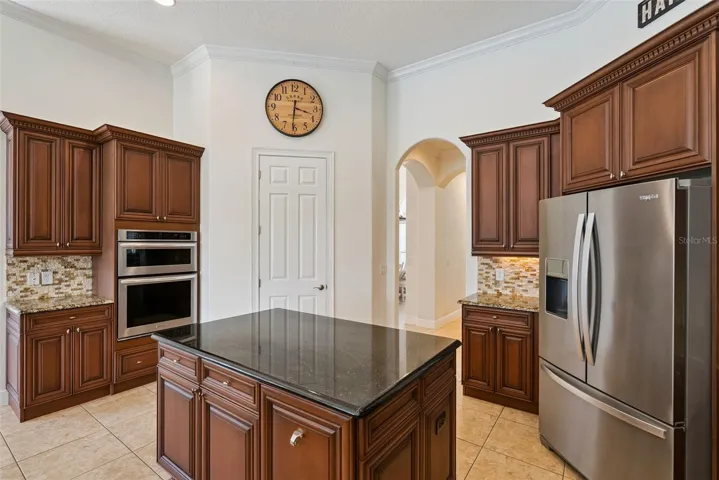 KitchenSpacious kitchen featuring abundant cabinetry, generous counter space and an easy connection to the main living areas.