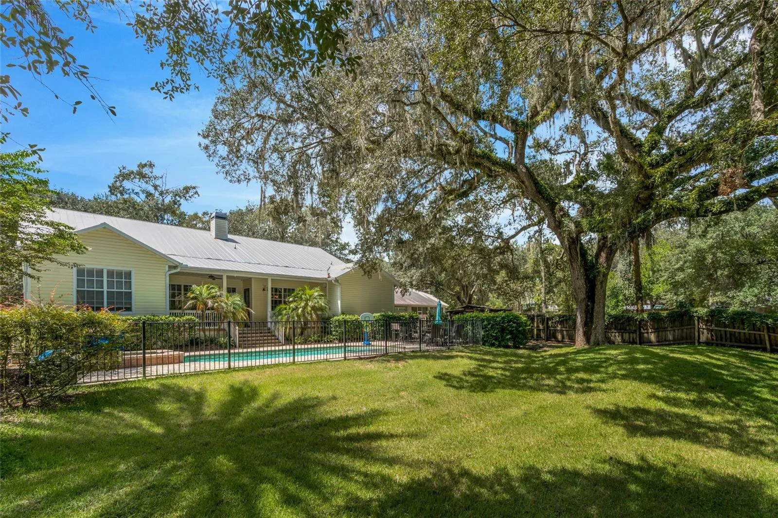 Back of house with pool