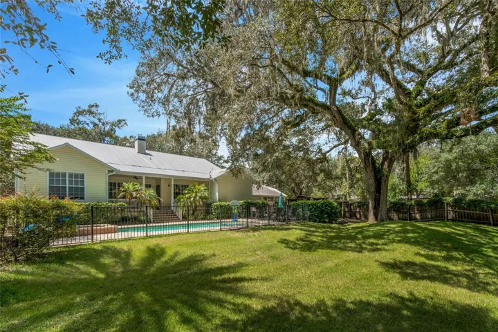 Back of house with pool