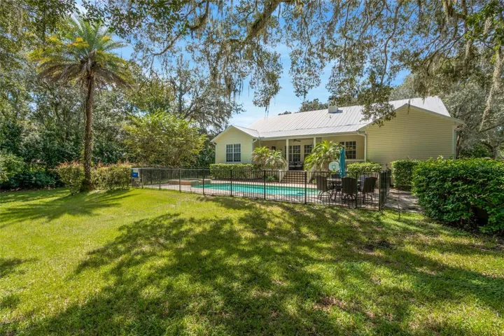 Back of house with pool