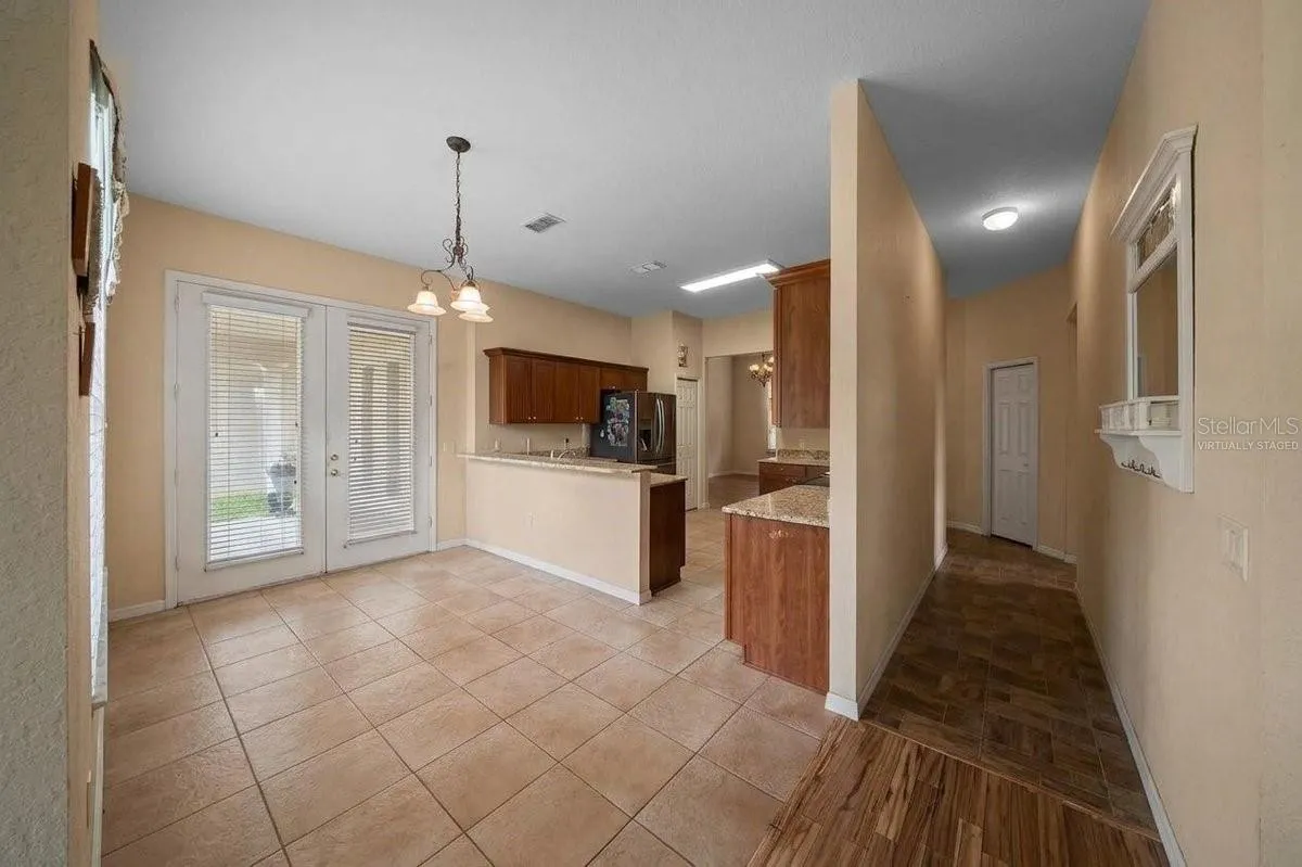 Kitchen/ Hallway to two of the four bedrooms Virtually Staged