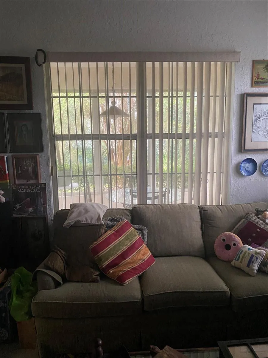 Den area with large window facing the lanai area.