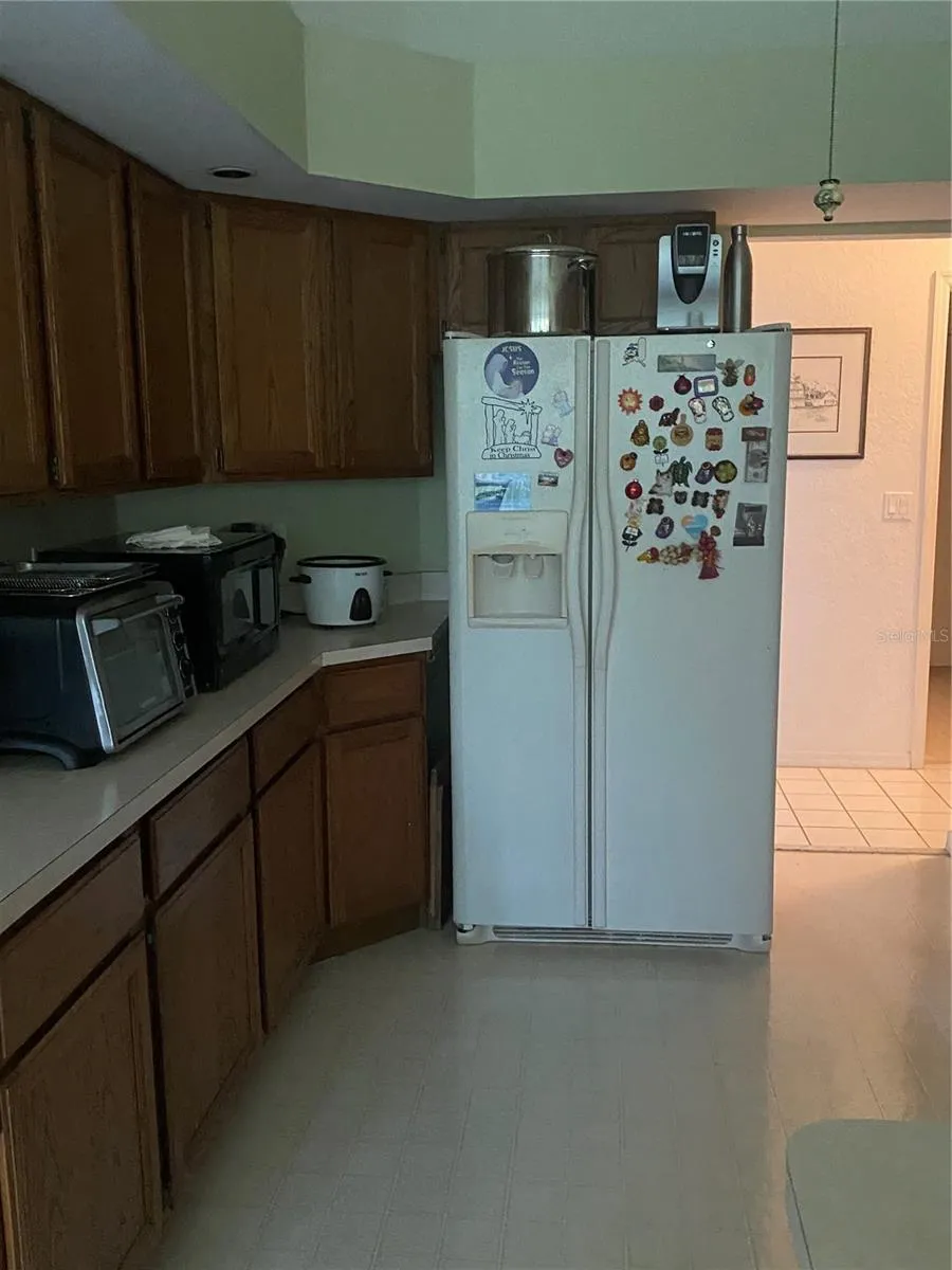 Open kitchen with plenty of cabinets and drawers, plenty of counterspace for small appliances.