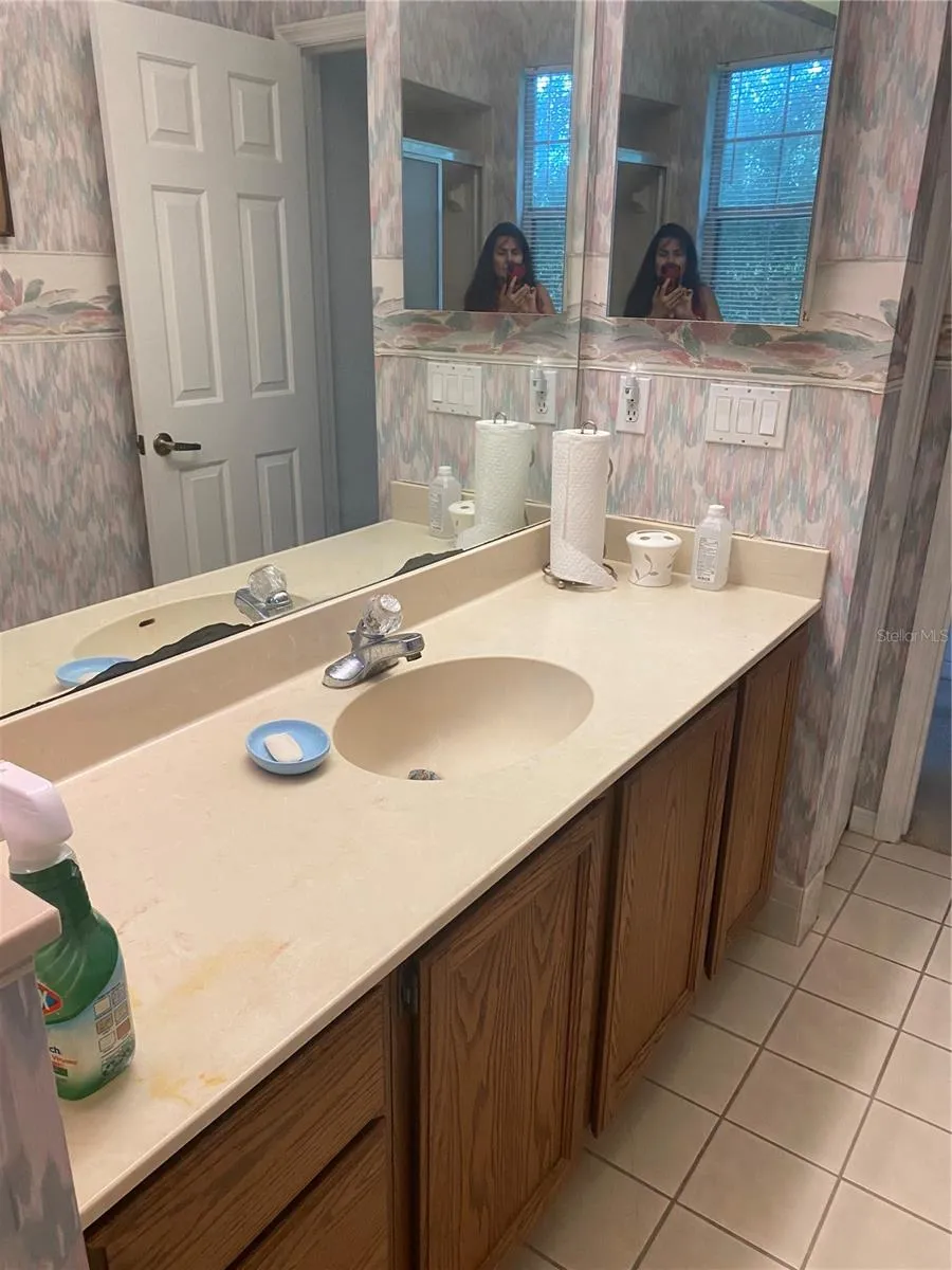 Guest bathroom with vanity and plenty of drawers and cabinet.