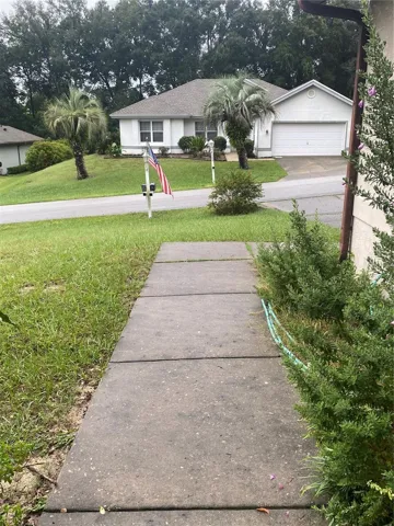 Walkway to the entrance of the house. View from the front of the house.