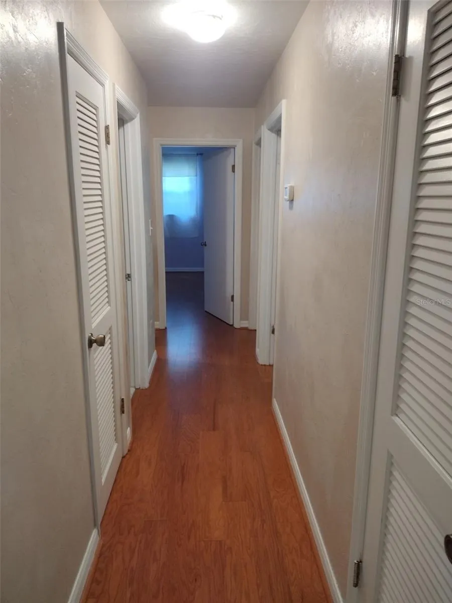 Hallway to Bedrooms and Full Bathroom