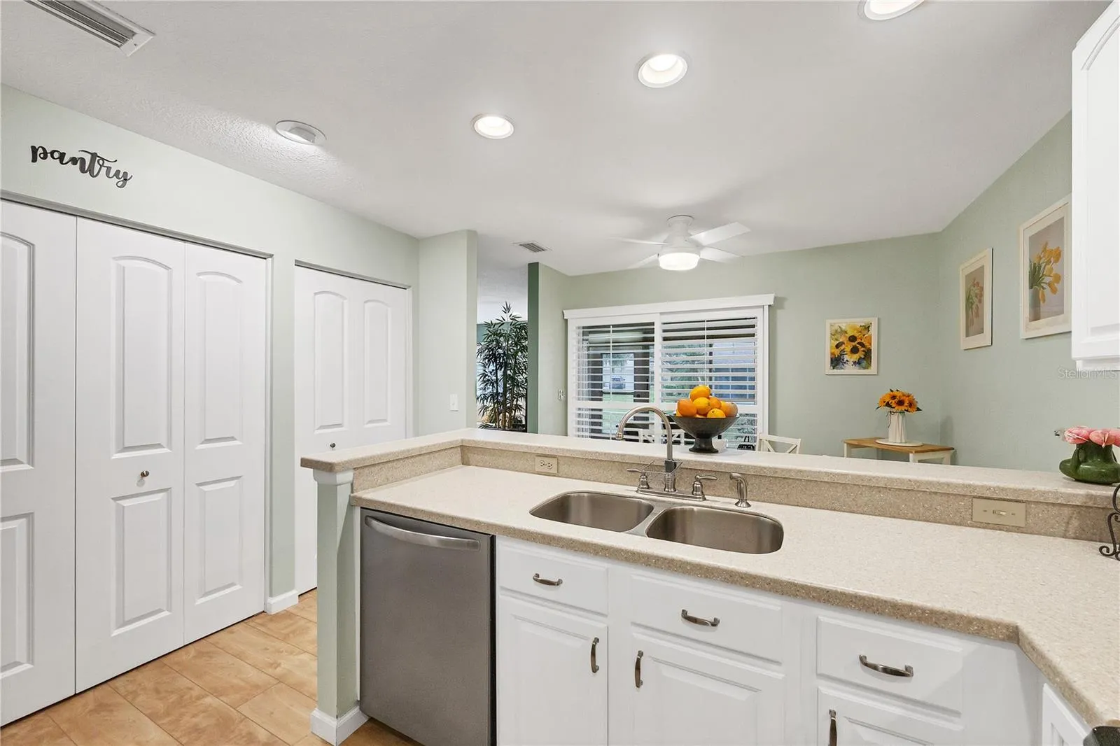 Kitchen with pantry doors on the left
