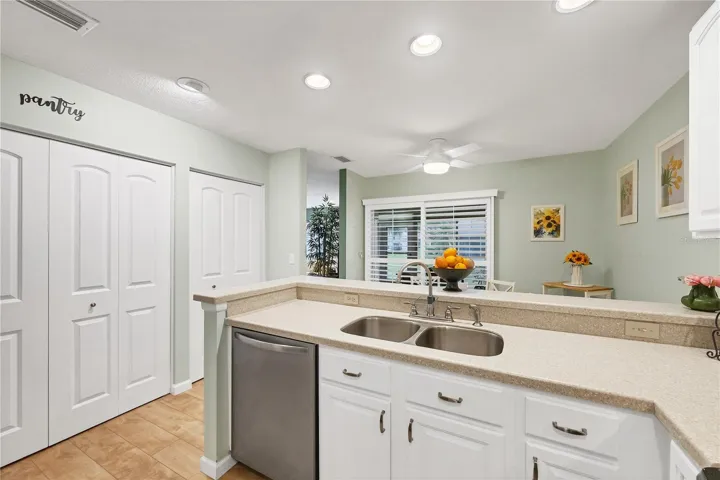 Kitchen with pantry doors on the left