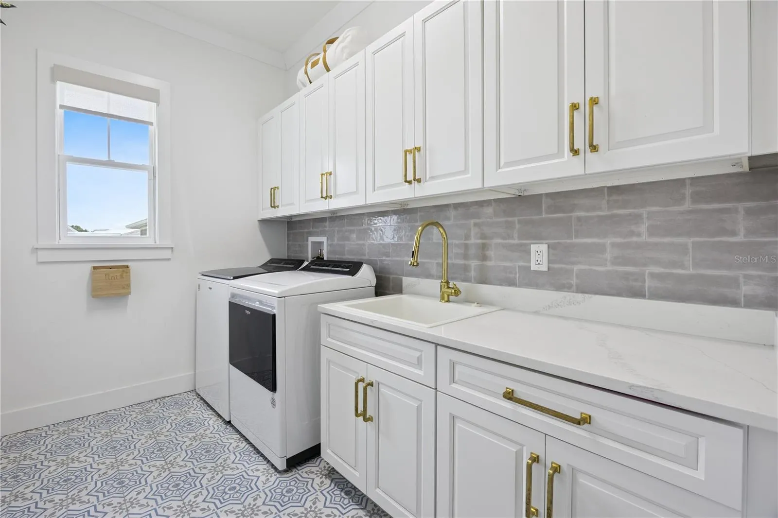 First floor laundry with designer tile