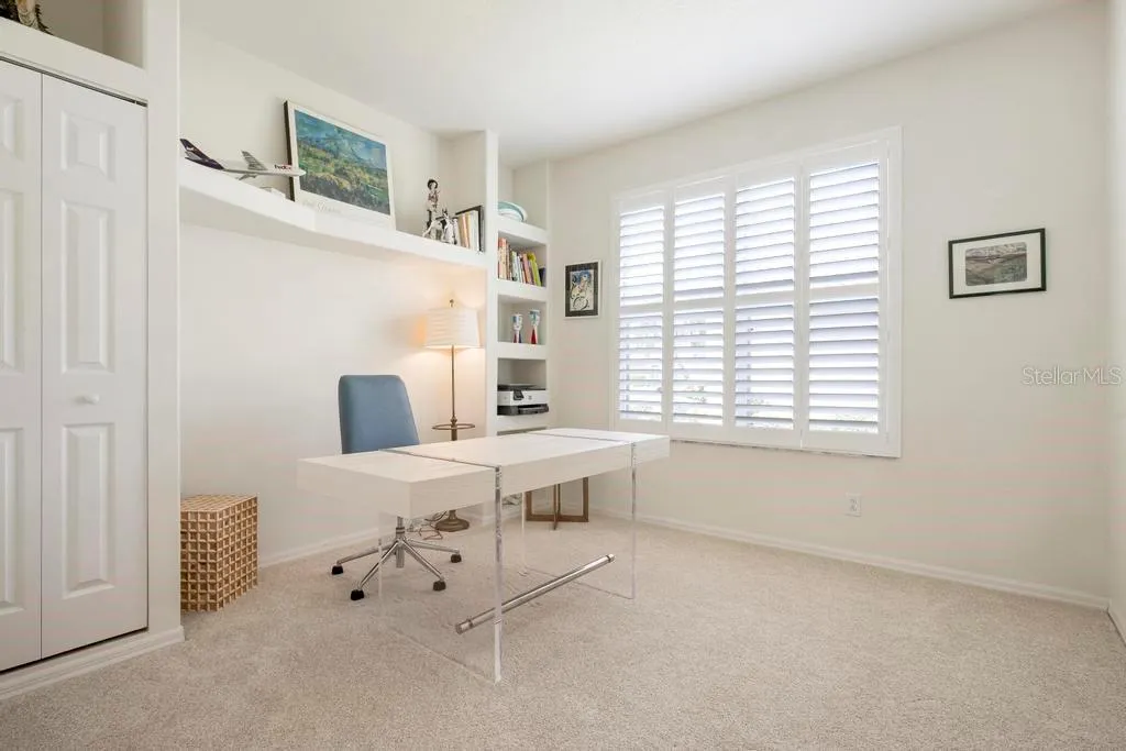 Study/Den with closet,  built-ins, and plantation shutters