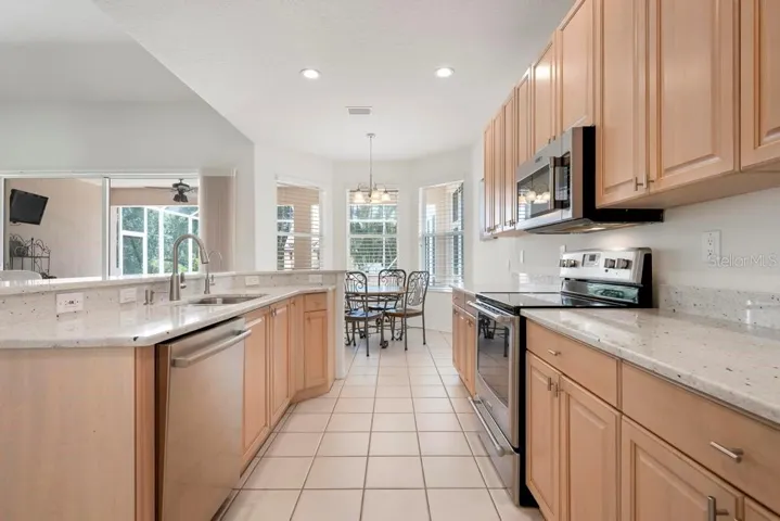 Kitchen with quartz counters and stainless appliances