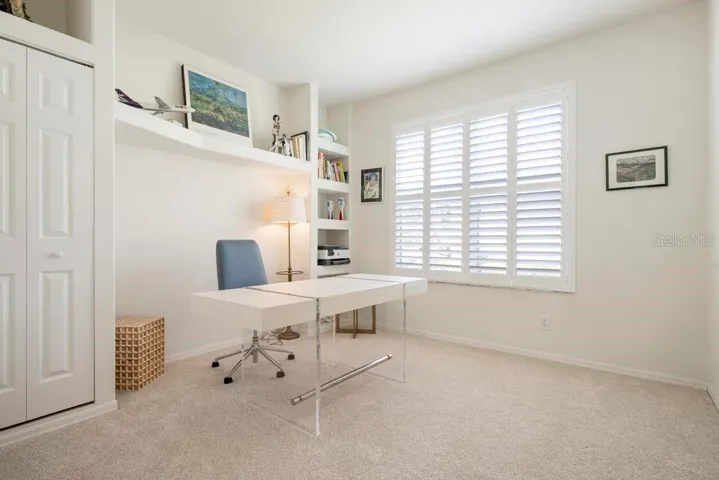Study/Den with closet,  built-ins, and plantation shutters